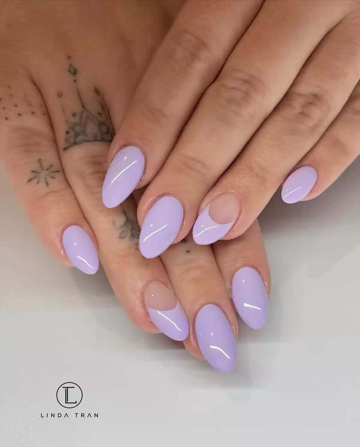 Glossy pastel lavender almonds with negative-space half-moons