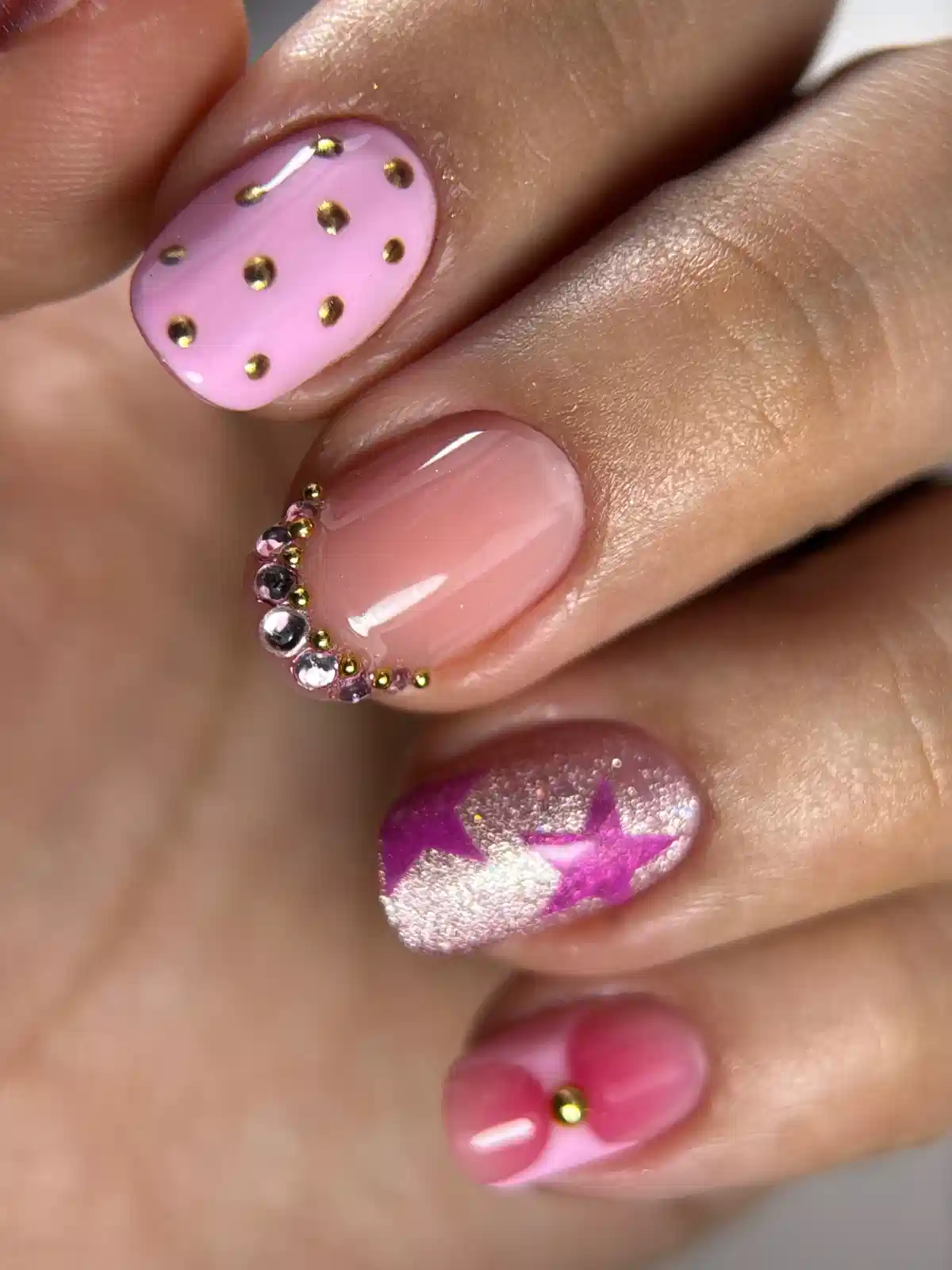 Short pink set with studs, rhinestone curve, and star accent