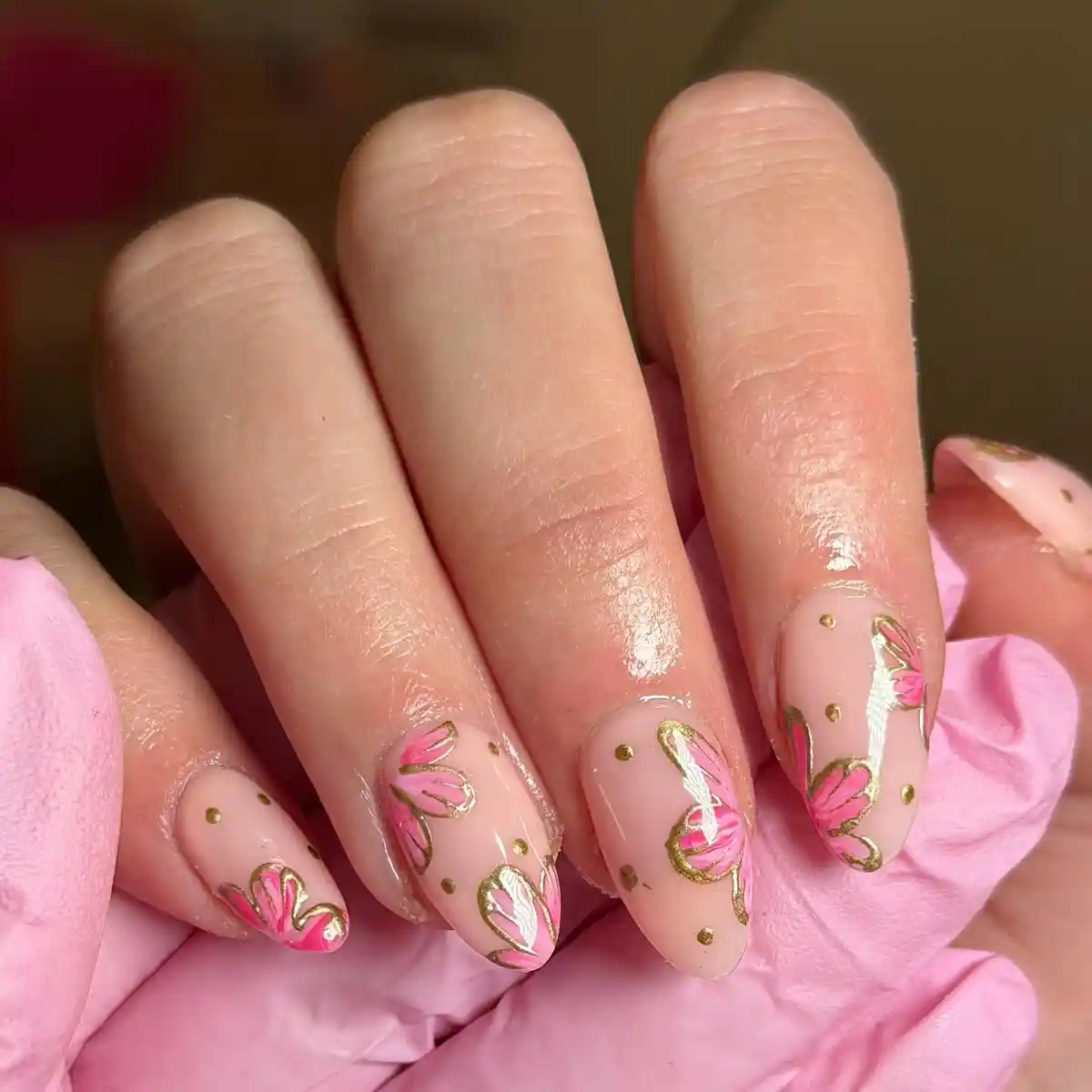 Sheer pink base with gold-outlined floral motifs and dots