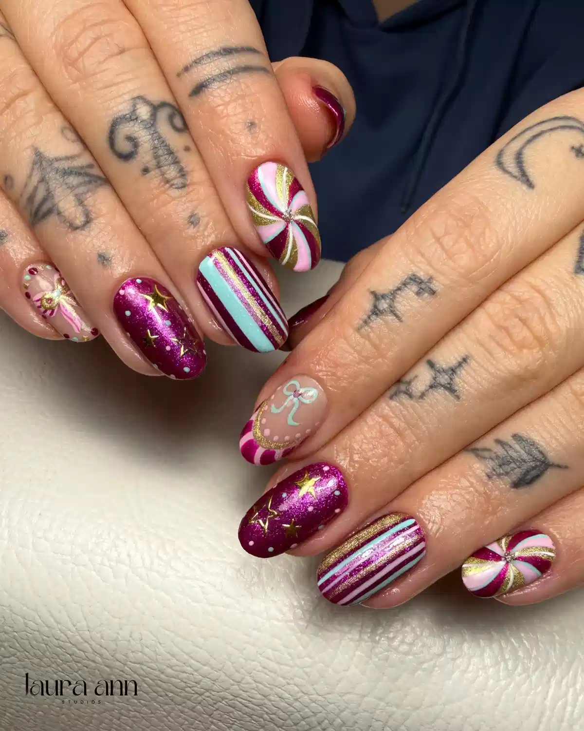 Magenta metallic set with stripes, swirls, and bow accents