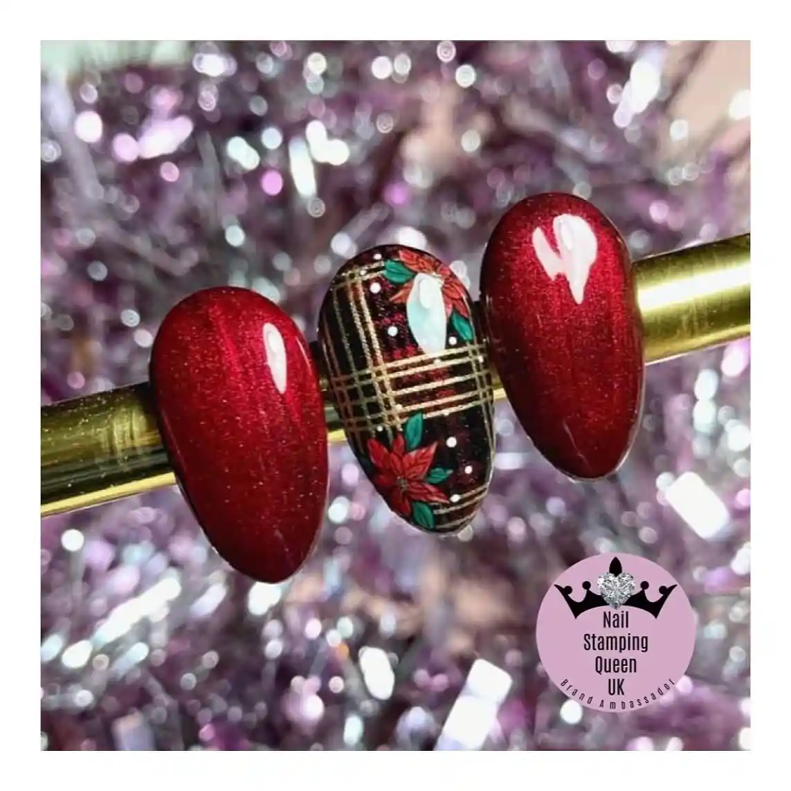 Red shimmer tips with black-and-gold plaid floral accent