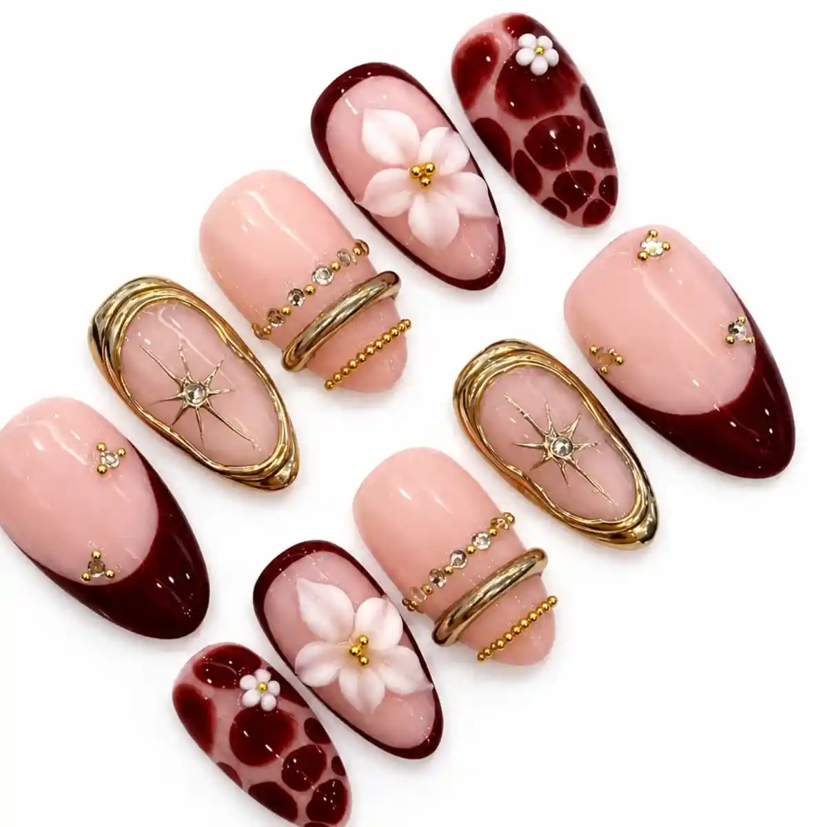 Burgundy and nude set with gold frames, flowers, and starburst gems
