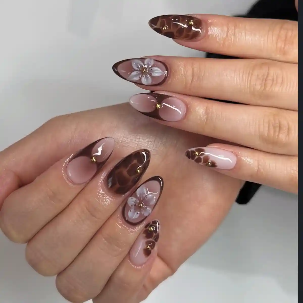 Nude and brown spot accents with raised floral details