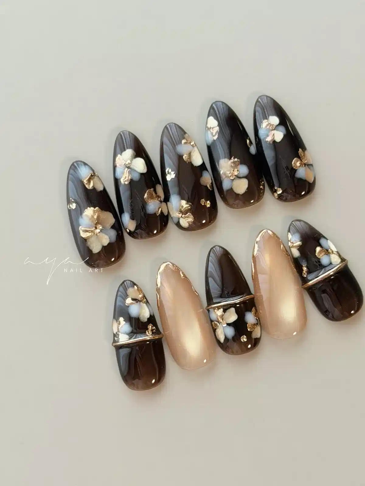 Smoky dark set with pale floral accents and gold foil-like flecks