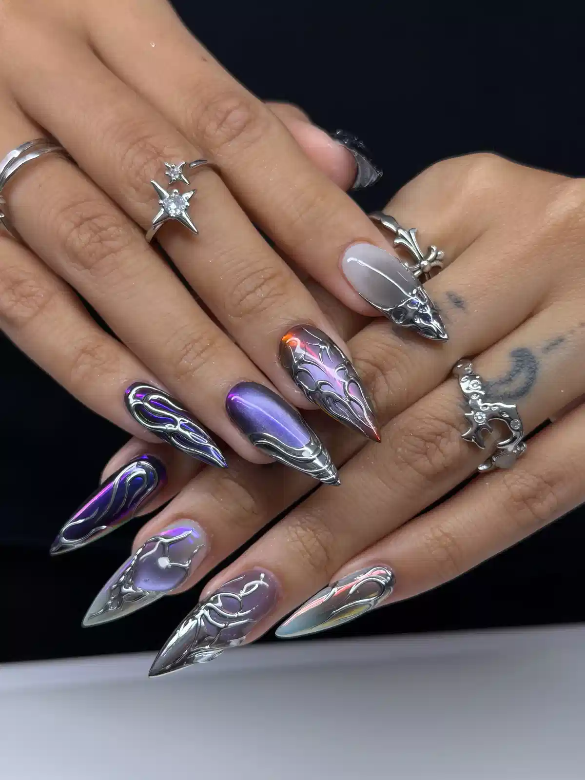 Chrome 3D linework with iridescent purple accents