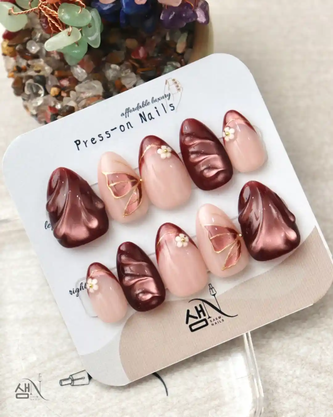 Maroon and nude press-on set with sculpted texture and tiny flowers