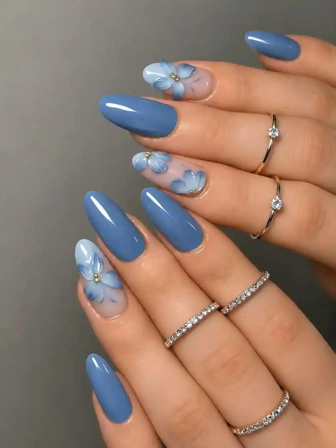 Glossy blue set with floral accent nails