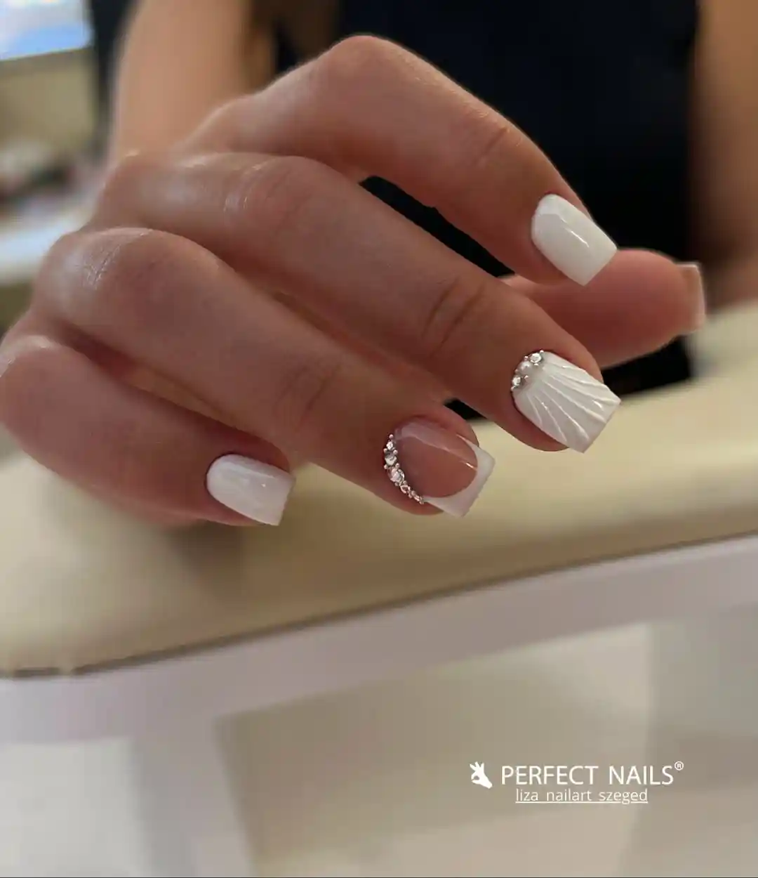 Glossy white squares with rhinestone arc and textured accent
