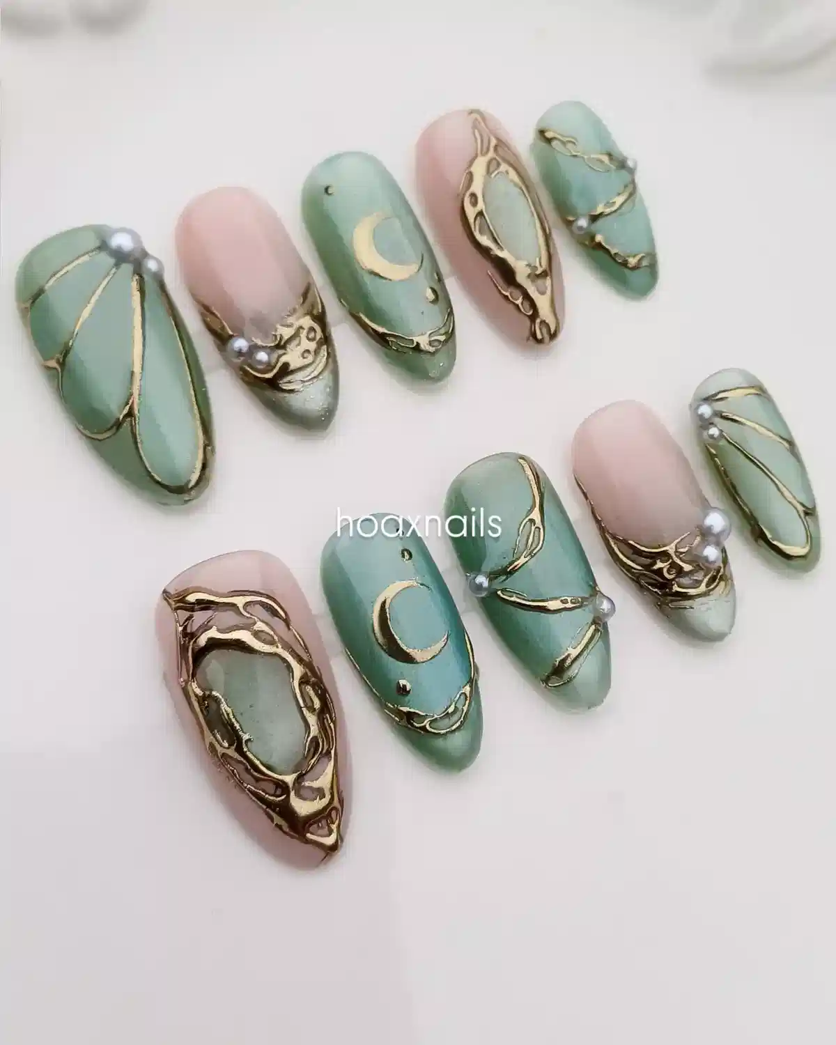 Muted green and nude set with gold raised accents and moon motifs