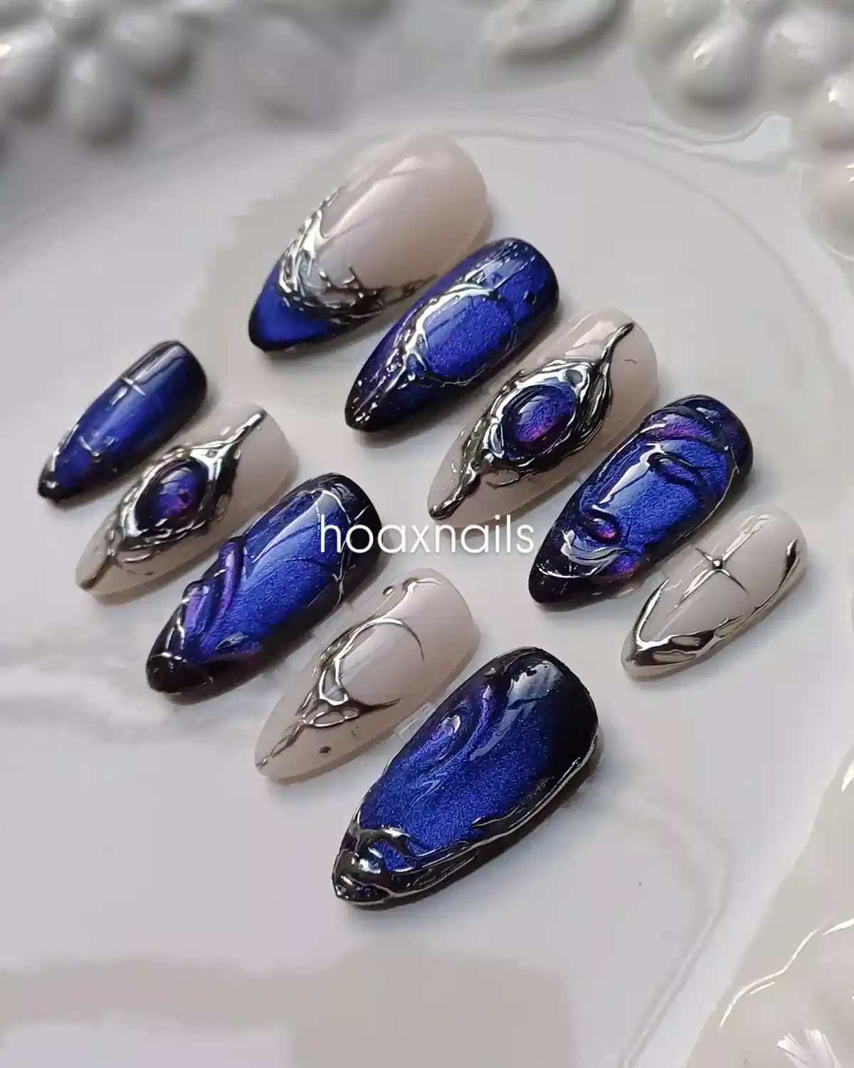 Deep blue and nude set with raised silver-toned sculptural details
