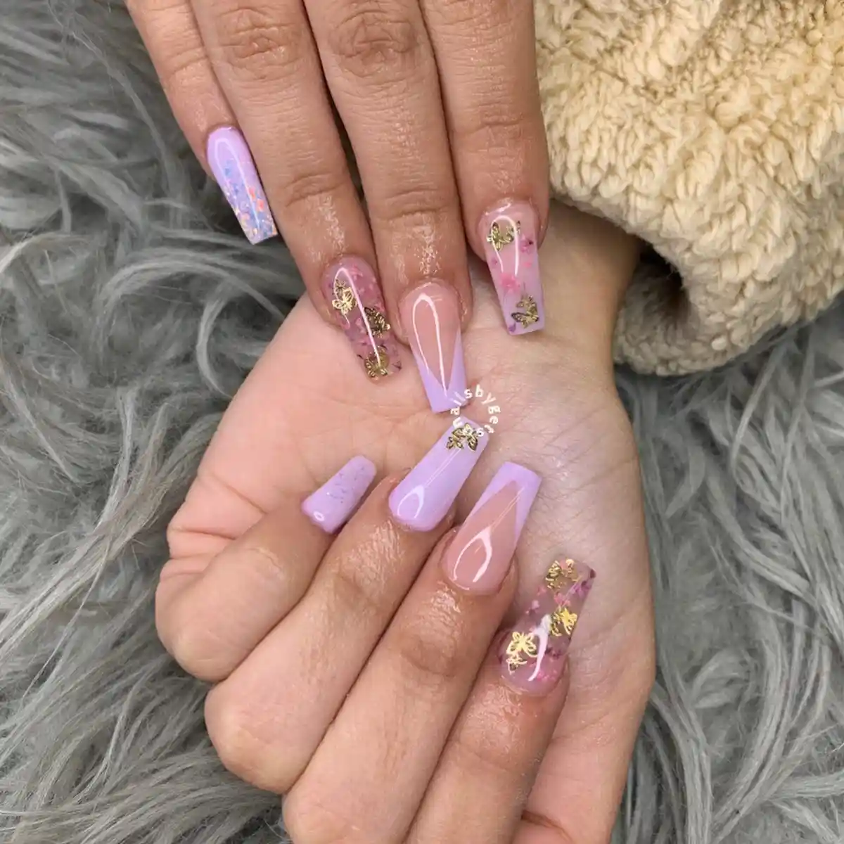 Lavender coffin nails with gold butterfly charms and mixed accent designs