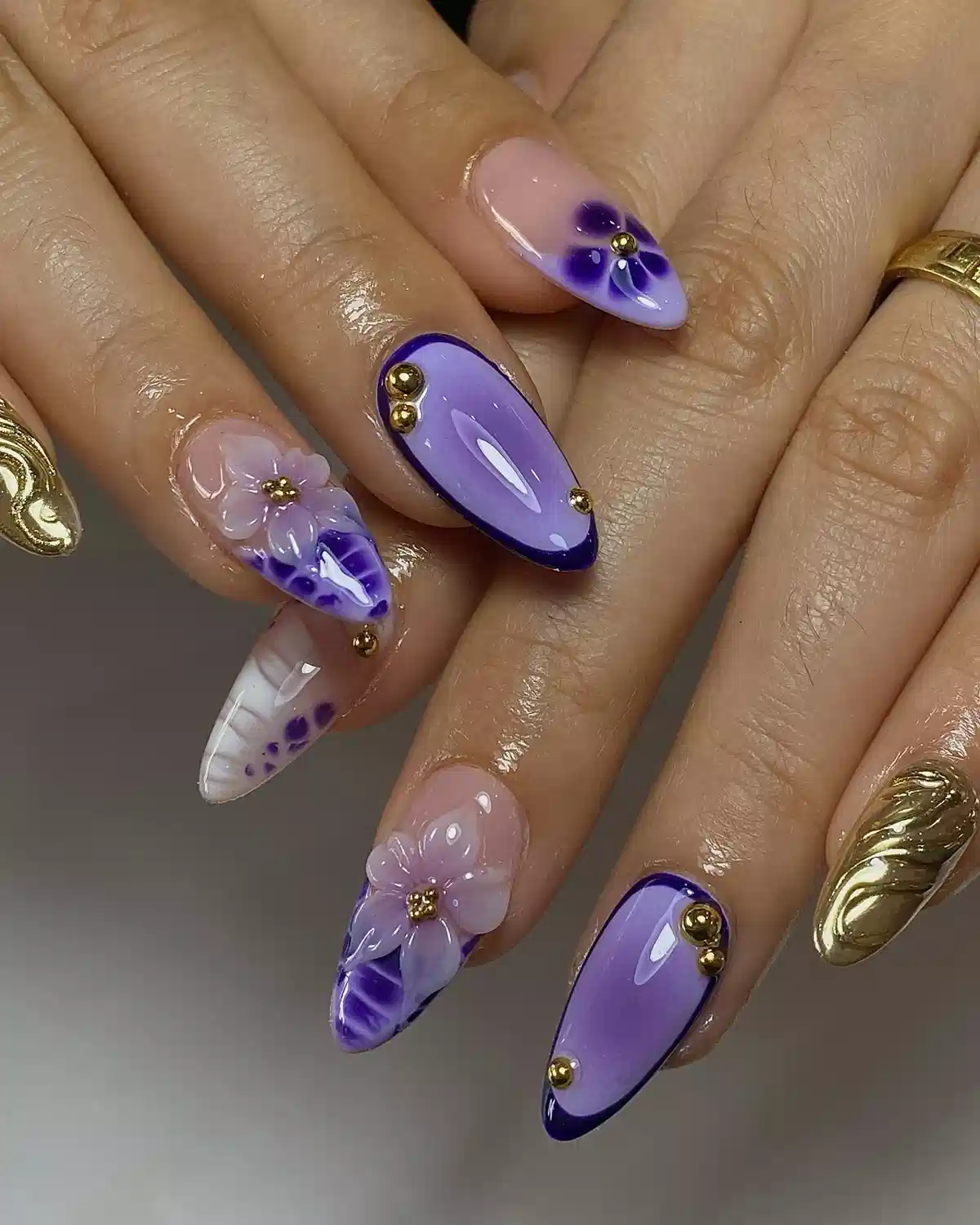 Lavender almond nails with deep purple edging and 3D flowers