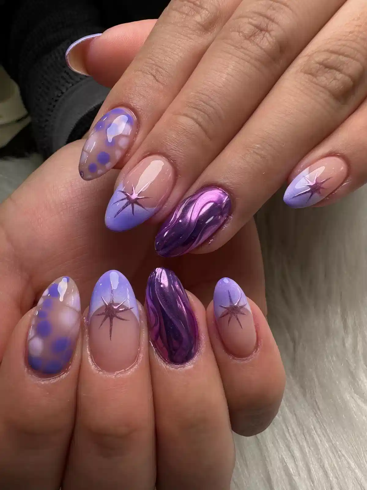 Lavender tips with starbursts and metallic purple accents