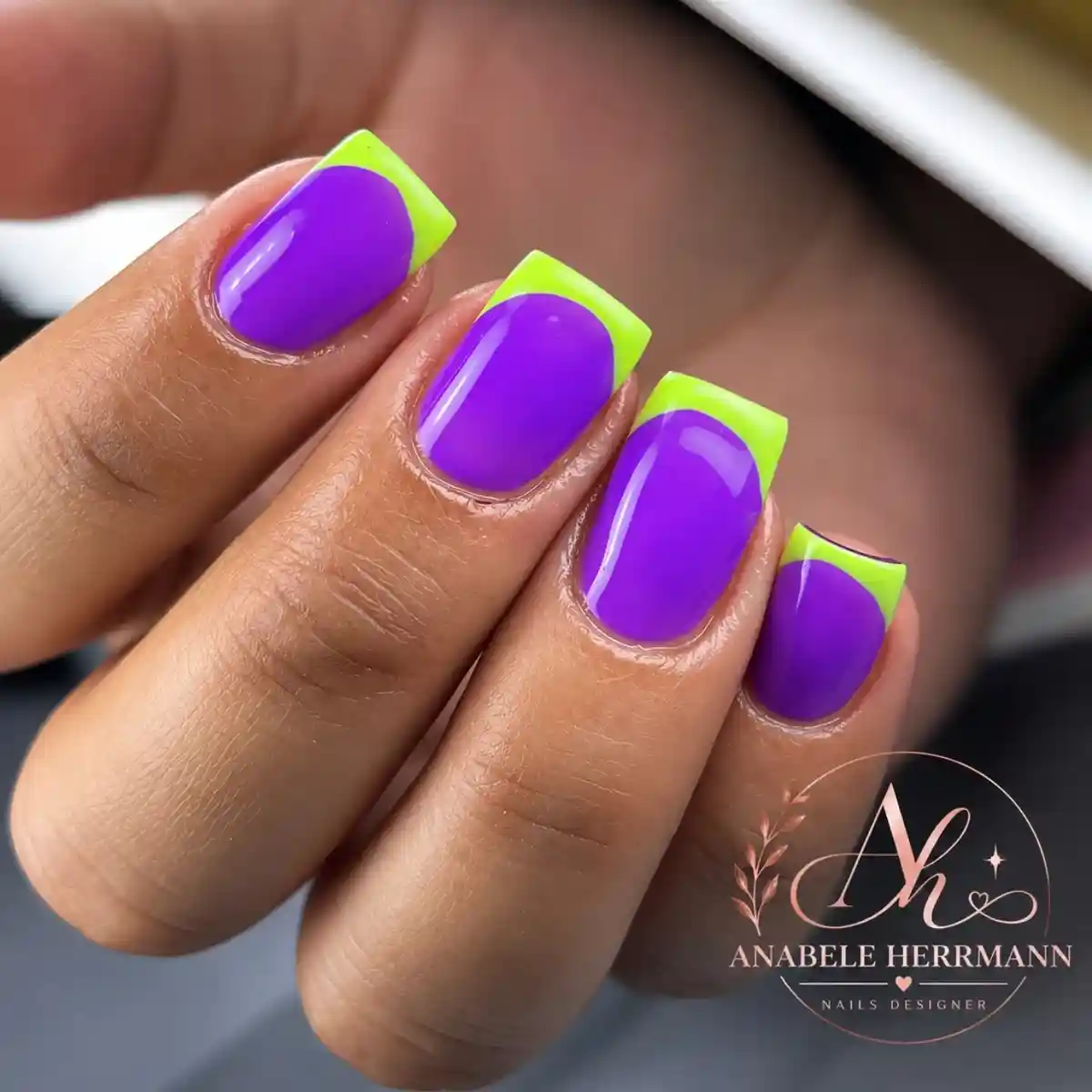 Purple glossy nails with neon yellow-green French tips