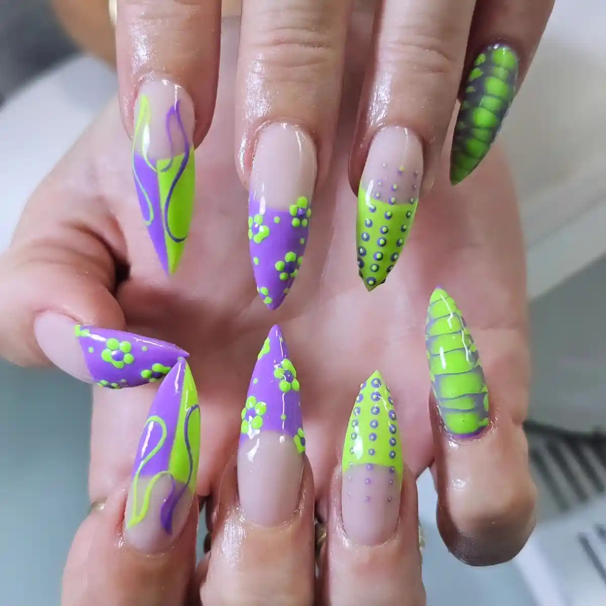Stiletto set with abstract lines, dotted details, and a scaled accent
