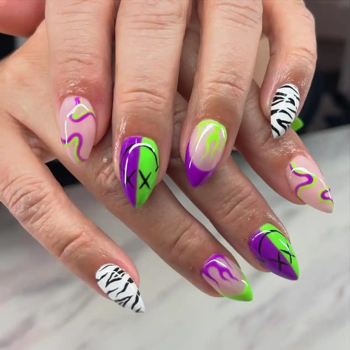 Wavy lines, color-blocking, and zebra accents in purple and green