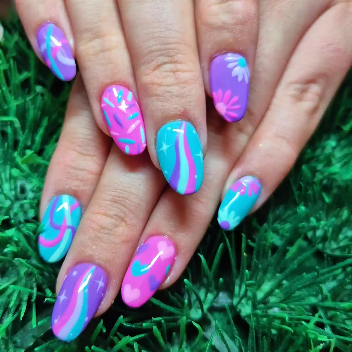 Playful teal, purple, and pink mixed nail art
