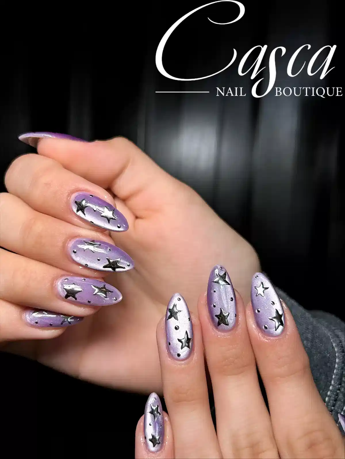 Lavender nails with raised silver stars and studs