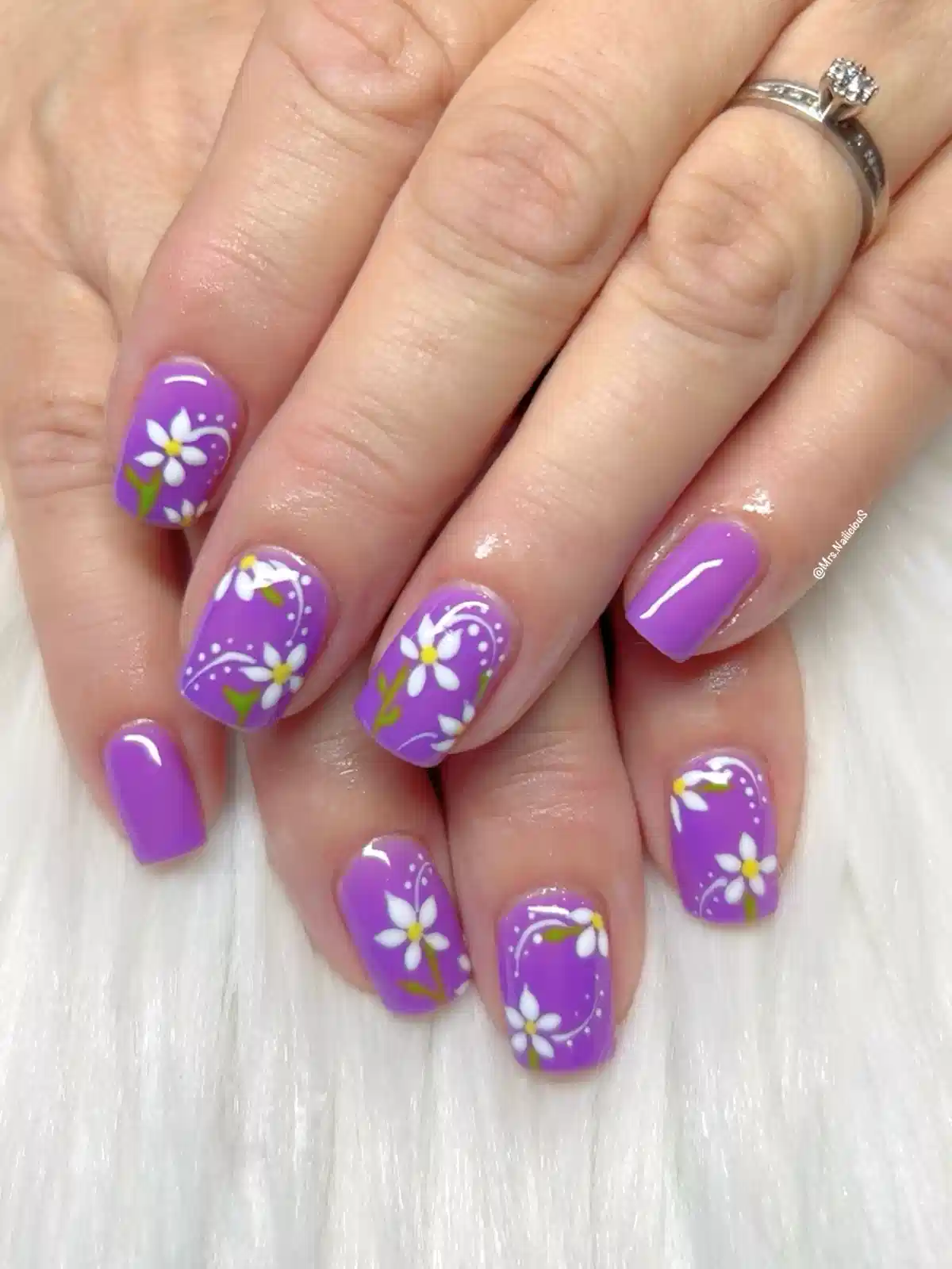Purple daisies with white dot-and-swish details