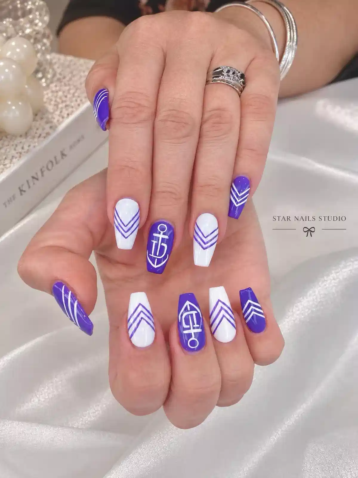 Purple-and-white nautical chevrons with anchor accents