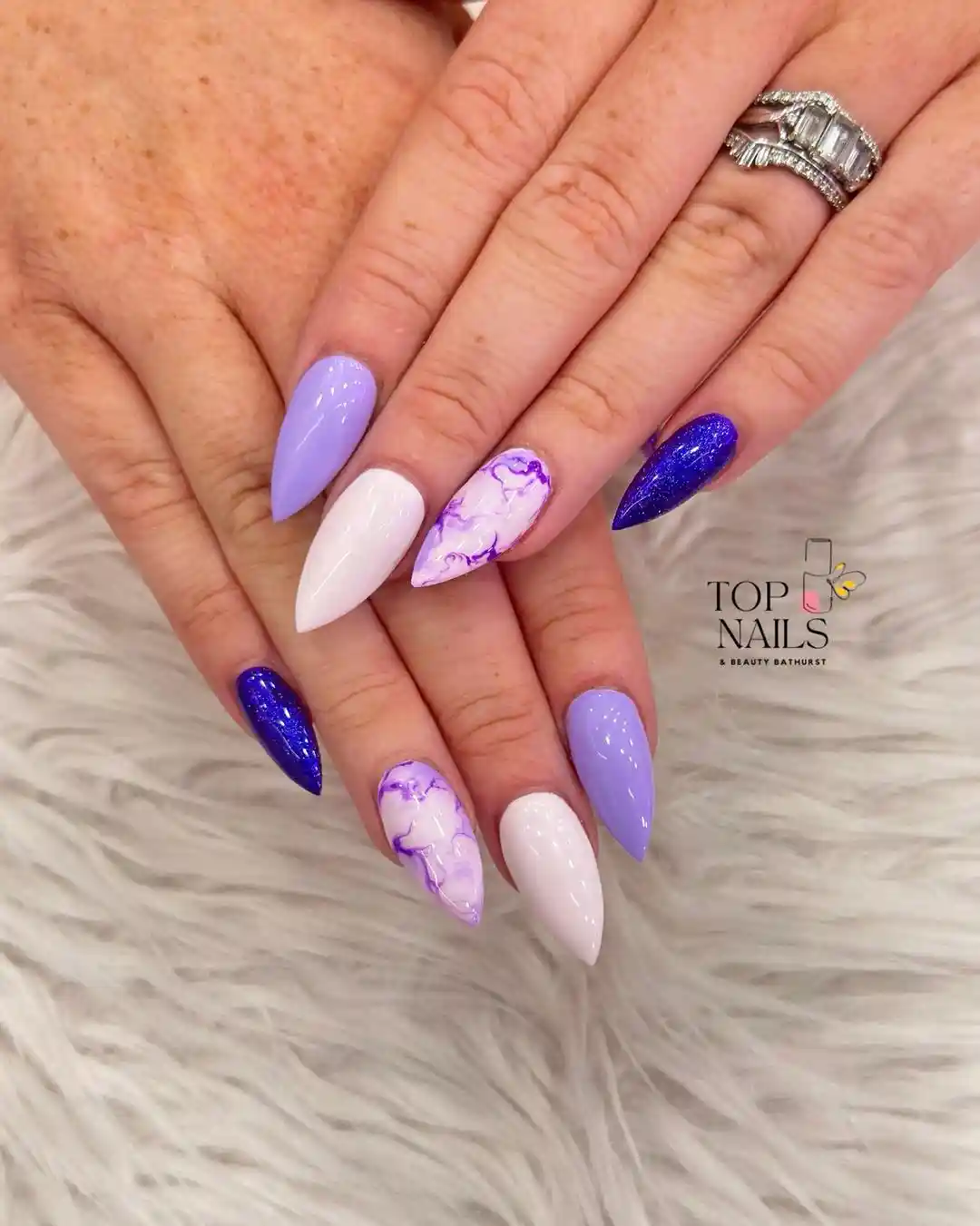 Stiletto set with white, lavender, marbled accents, and deep glitter purple