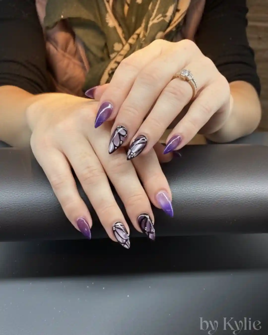 Purple stiletto set with black-and-silver abstract accent nails