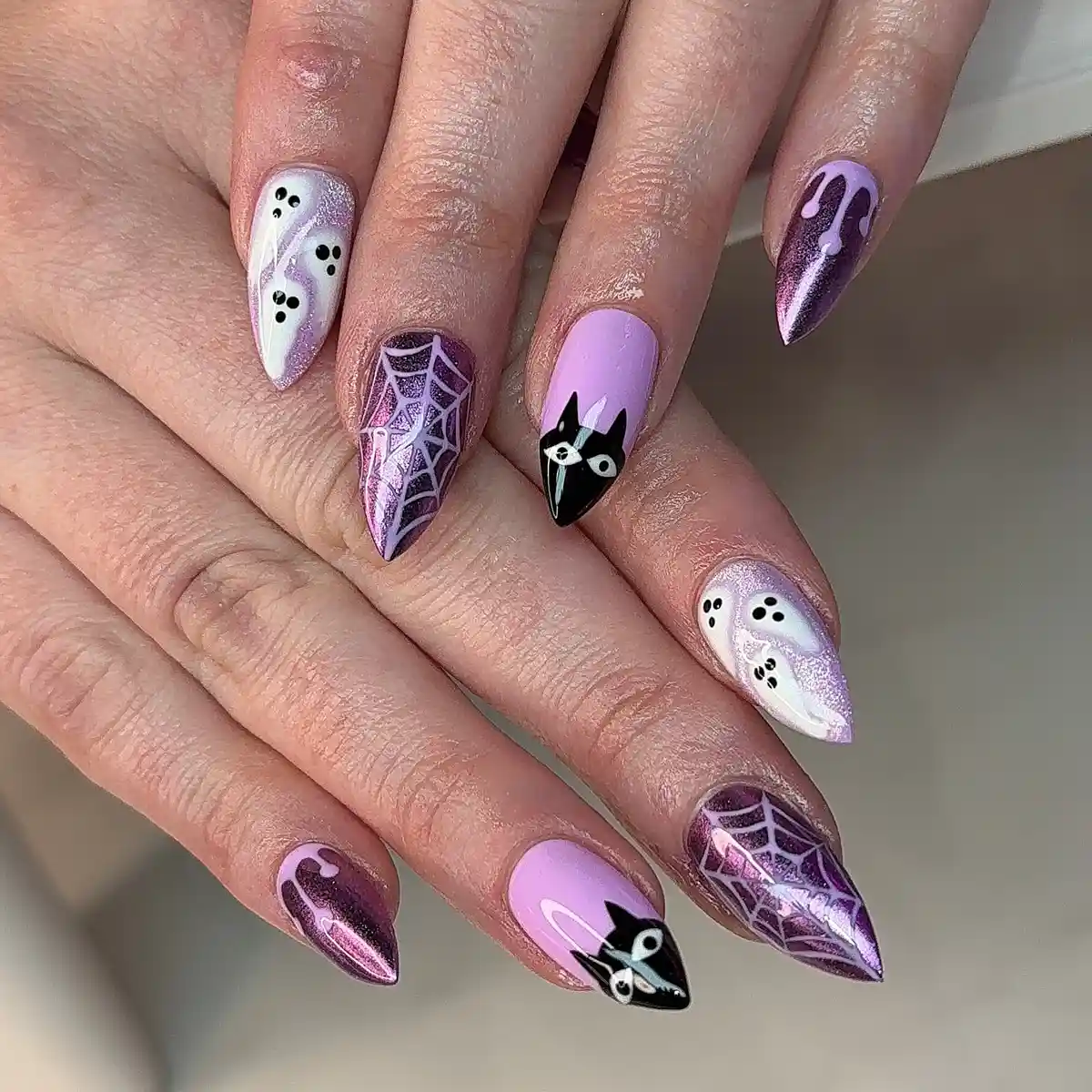 Lavender cat faces with spiderweb and drip accents