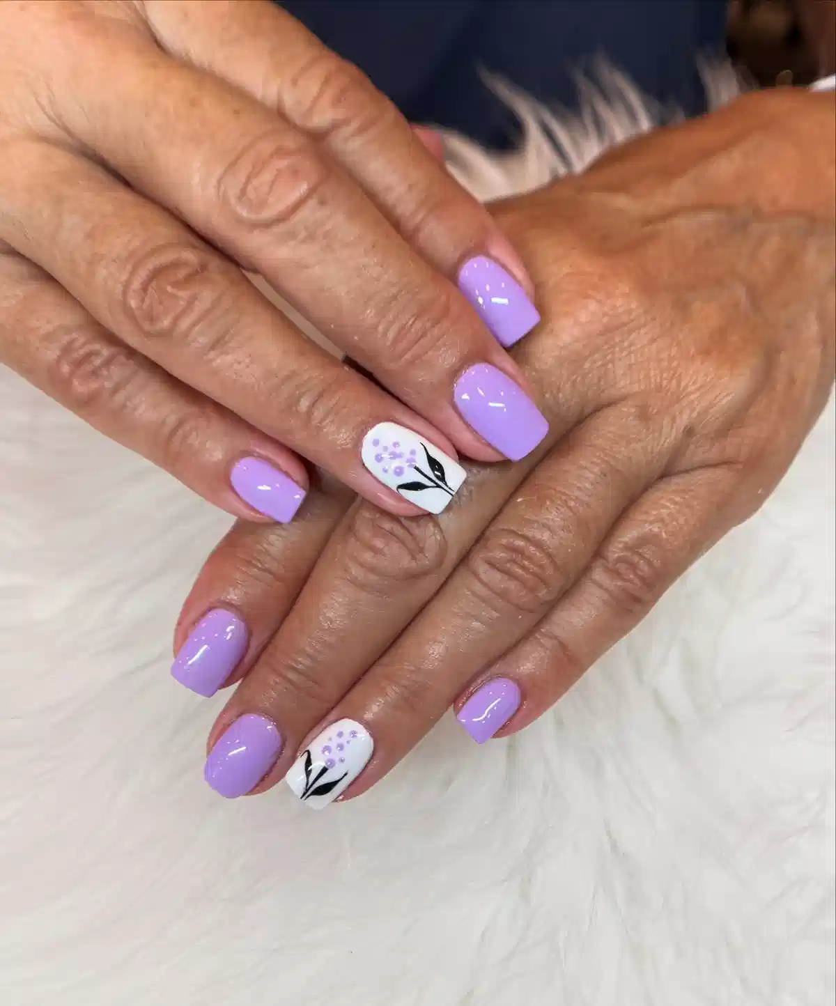 Lavender solids with white floral-branch accent nails