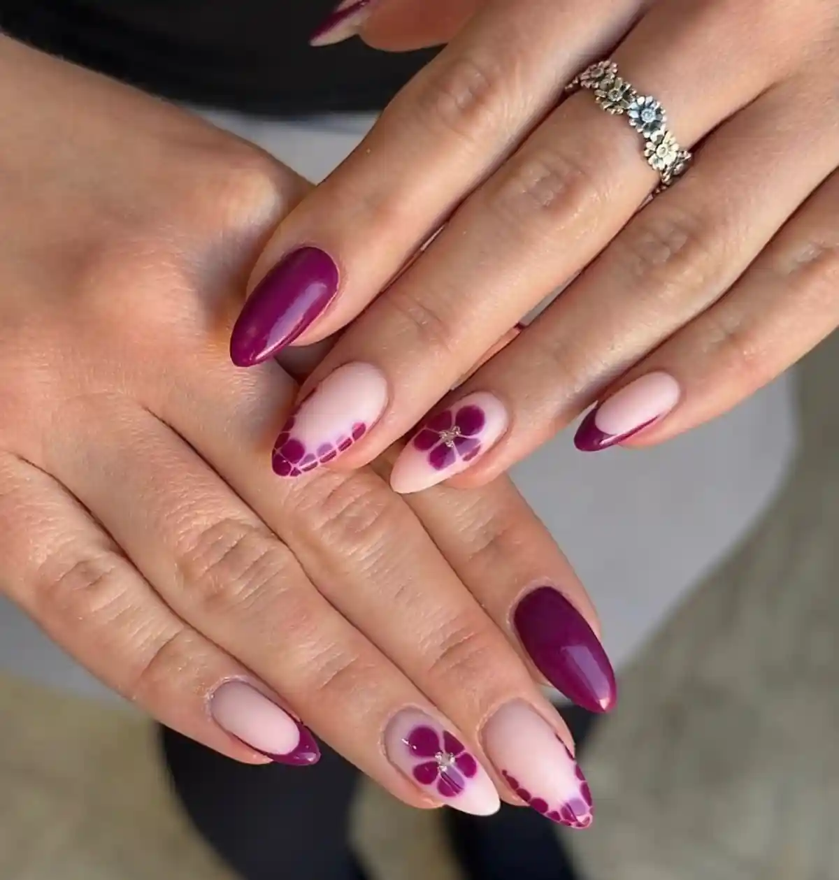 Pale pink base with magenta-purple tips and flower accents