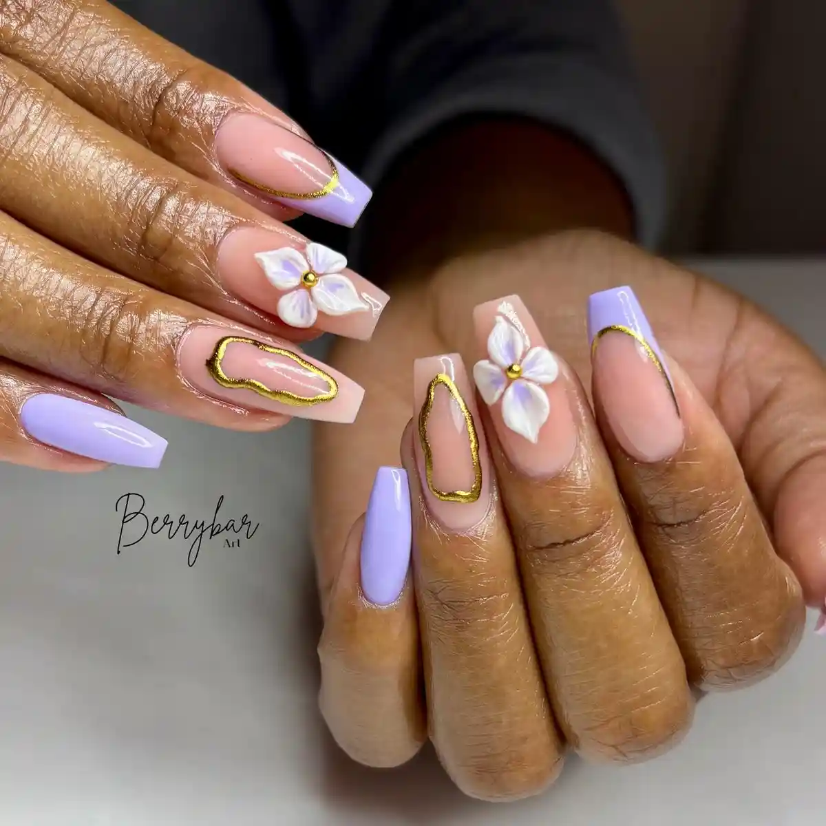 Lavender French tips with gold outlines and 3D white flowers