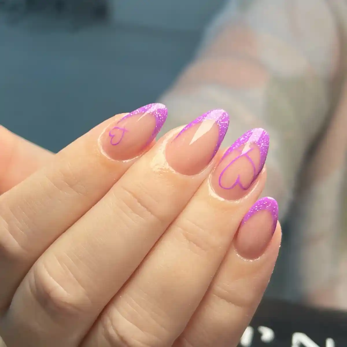 Glitter purple French tips with heart outline accents