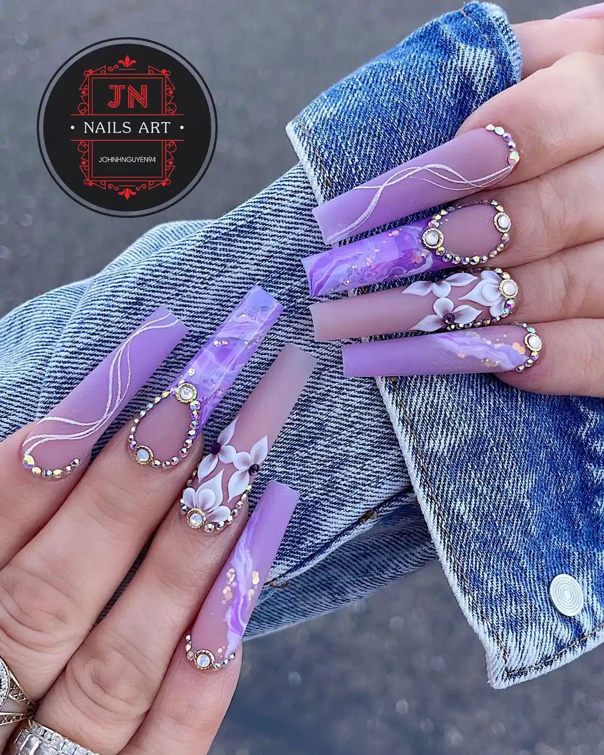 Lavender coffin nails with rhinestone framing and 3D flowers