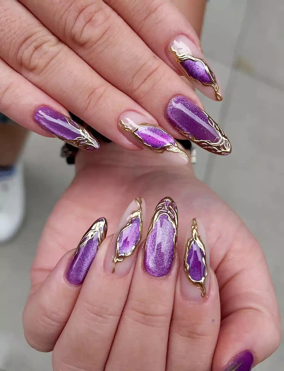 Purple shimmer panels with gold raised outlines