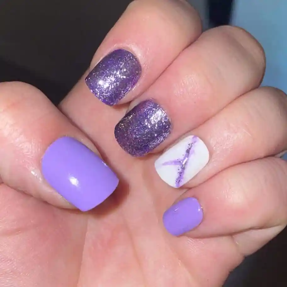 Lavender and glitter purple mix with a white accent nail