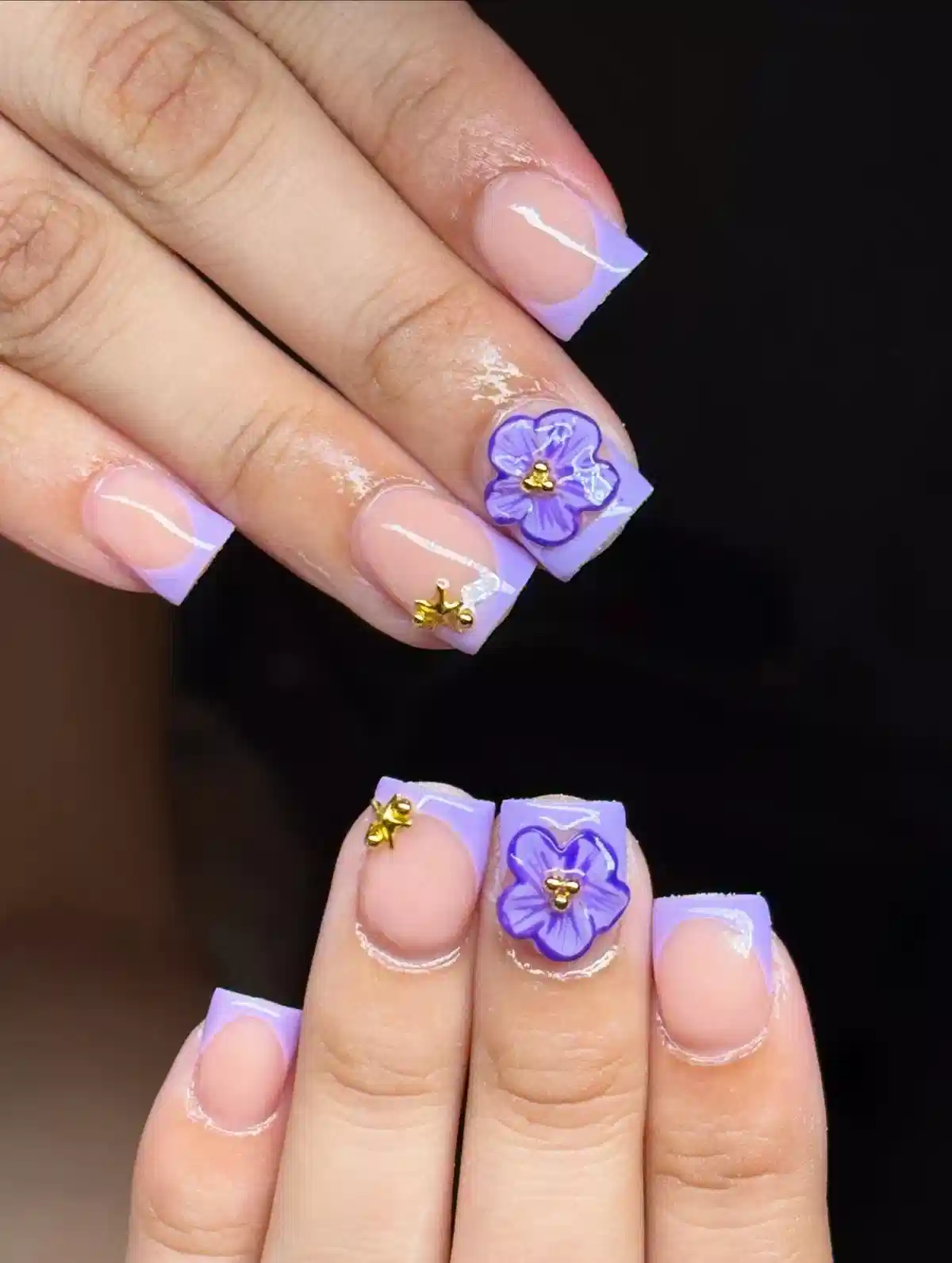 Lavender French tips with raised purple flowers and gold accents