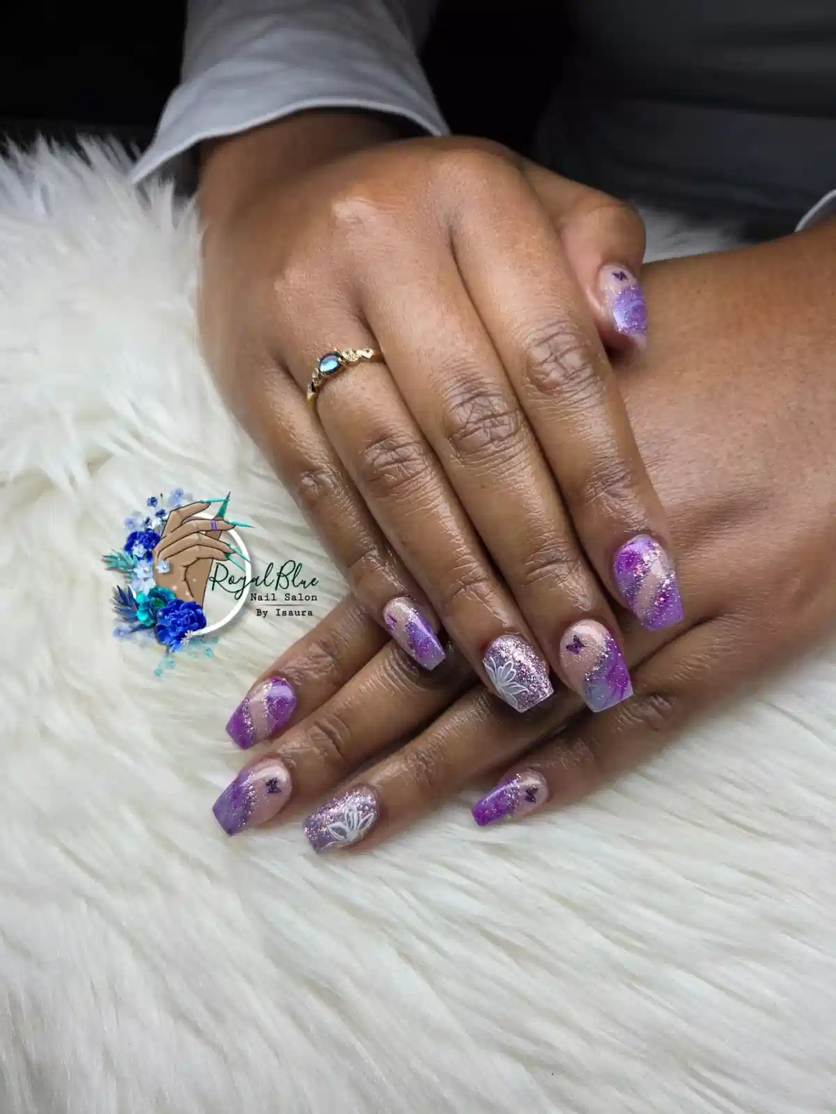 Purple glitter gradient nails with star and butterfly-like details