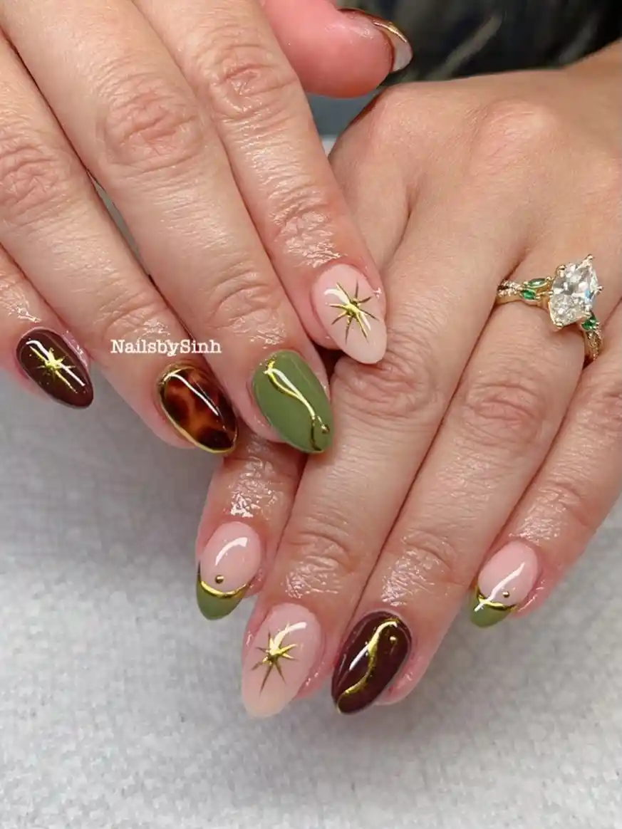 Nude, Brown, and Olive Nails with Gold Starbursts
