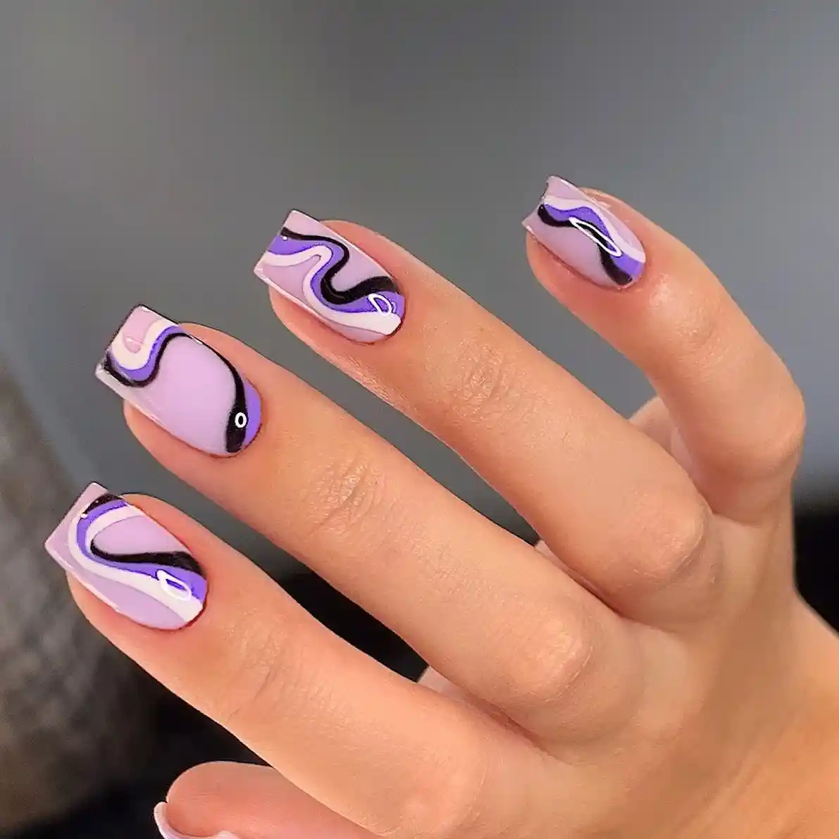 Square swirl nails in lilac, black, and white