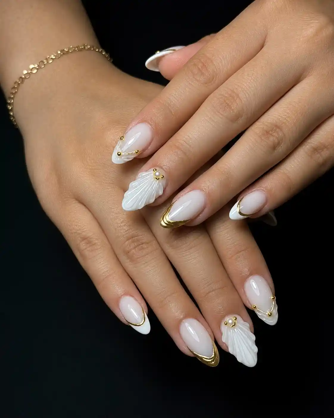 Gold-edged French tips with 3D shell accents