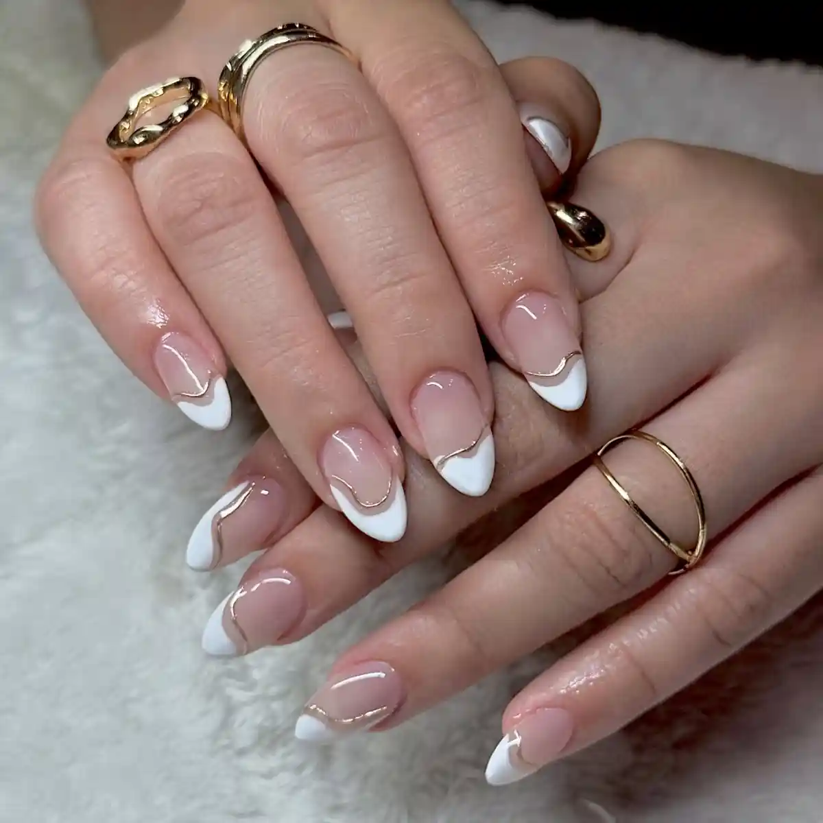 Wavy gold-outlined French tips
